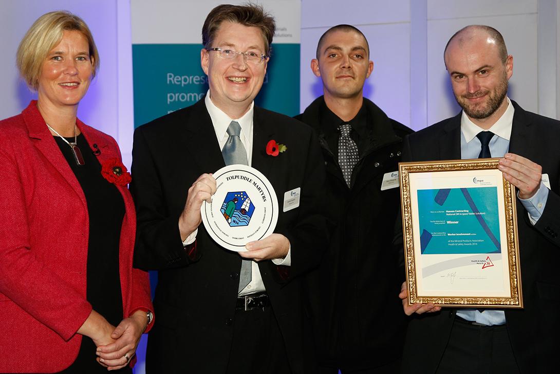 Winners... contracting division business improvement manager Jamie Bowen received the TUC Trophy for worker involvement from former RAF figher pilot Mandy Hickson. Also pictured are business analyst Chris Harrison, right, and surfacing operator Gary Edwards